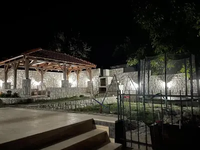 a park at night with a gazebo at Apartments Bujkovic in Bar