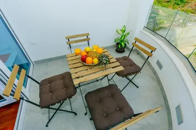 a room with a table with fruit on it at Apartments Bujkovic in Bar