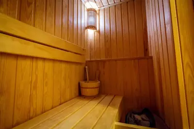 a small wooden sauna with a wooden floor at Luxury Budva Center Apartments in Budva