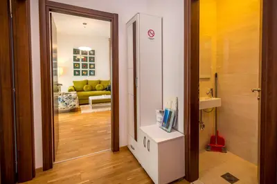 a hallway with a door leading to a living room at Luxury Budva Center Apartments in Budva