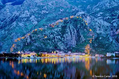 a view of a mountain with a town and a body of water at Apartment Miguel in Kotor