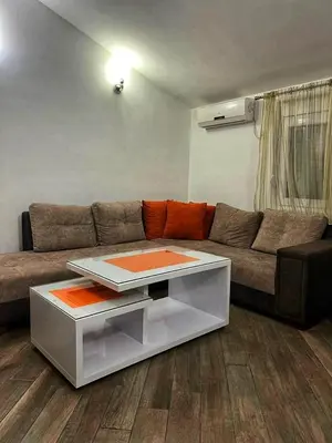 a living room with a couch and a coffee table at Apartmani Jankovic in Budva
