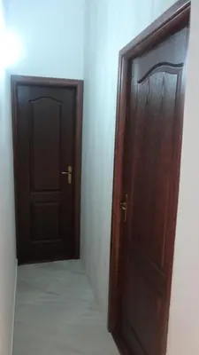 an open door in a room with two doors at Apartmani Jankovic in Budva