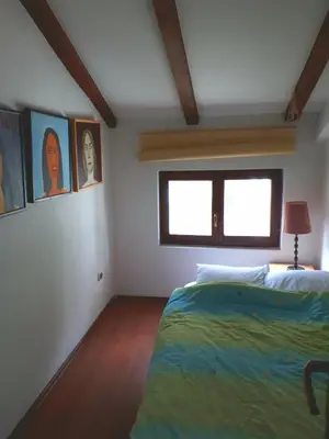 a bedroom with a bed and a window at Apartment Sasha in Kotor