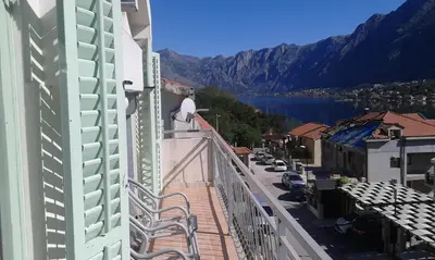 a balcony of a building with a view of a body of water at Apartment Sasha in Kotor