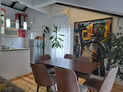 a dining room with a table and chairs at Apartment Sasha in Kotor