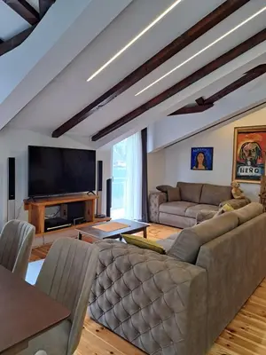 a living room with a couch and a television at Apartment Sasha in Kotor