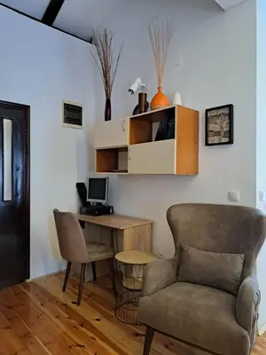 a living room with a desk and a chair at Apartment Sasha in Kotor