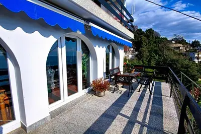 a balcony of a house with a table and chairs at Villa Blue Dreams in Bar