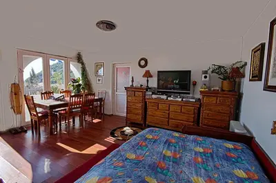 a bedroom with a dining room table and a bed at Villa Blue Dreams in Bar