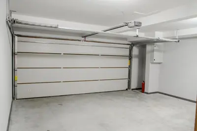 a garage with two garage doors in a room at Villa Hedonism in Sveti Stefan