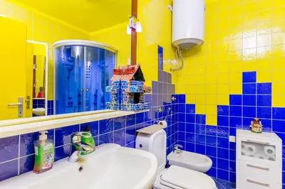 a bathroom with a toilet and a sink and a mirror at Spacious Central Magik in Kotor