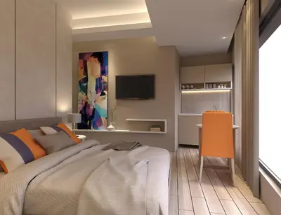 a bedroom with a large bed and a desk at Twister Apartments in Budva