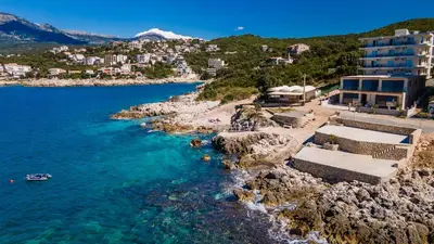 an aerial view of a beach next to the water at Open Sea Apartments in Utjeha