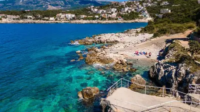 a view of a beach with people in the water at Open Sea Apartments in Utjeha
