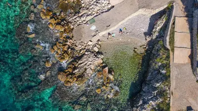 an aerial view of a beach with people on the shore at Open Sea Apartments in Utjeha