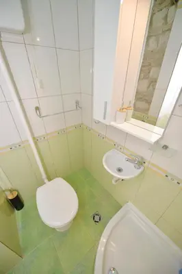 a bathroom with a toilet and a sink at Charming apartment in Kotor in Kotor