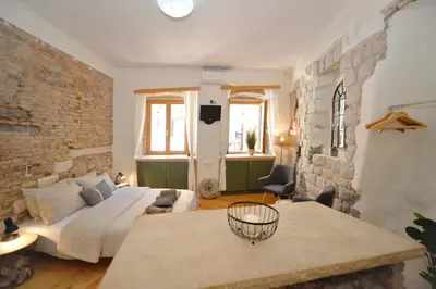 a large room with a bed and a couch at Charming apartment in Kotor in Kotor