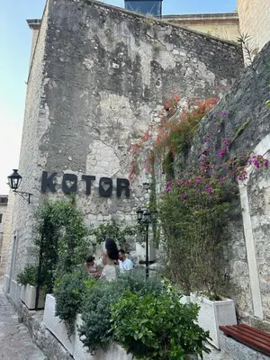 a group of people sitting in front of a wall at Charming apartment in Kotor in Kotor