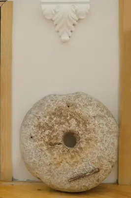 a donut sitting on a table next to a wall at Charming apartment in Kotor in Kotor