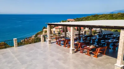 a restaurant with a view of the ocean at Arabela 2 Apartments in Utjeha
