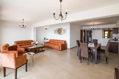a living room with a couch and a table at Arabela 2 Apartments in Utjeha