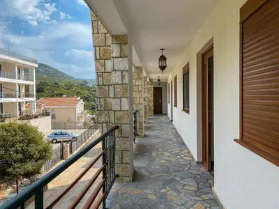 a hallway of a house with a balcony at Arabela 2 Apartments in Utjeha