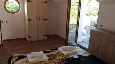 a bedroom with a bed with towels on it at Apartment Mond in Virpazar