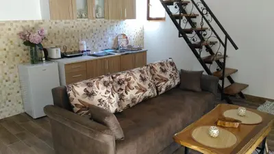 a living room with a couch and a table at Apartment Mond in Virpazar