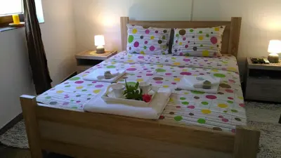 a bedroom with a bed with a tray of food on it at Apartment Mond in Virpazar