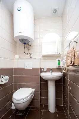 a small bathroom with a toilet and a sink at Apartment Sofija in Budva