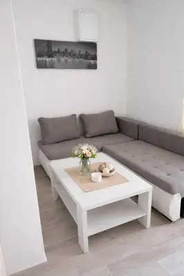 a living room with a couch and a table at Casa ROBI - Apartments in Ulcinj
