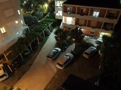 an aerial view of cars parked in a parking lot at Casa ROBI - Apartments in Ulcinj