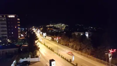 a city street at night with street lights at Apartment Veselin in Budva