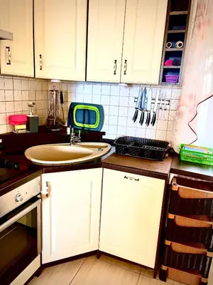 a kitchen with white cabinets and a sink at Holiday Home Viko in Sutomore