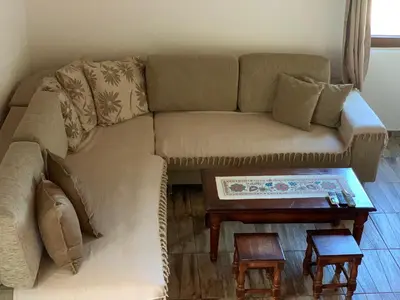 a couch with a coffee table in a living room at Holiday Home Bratica in Ulcinj