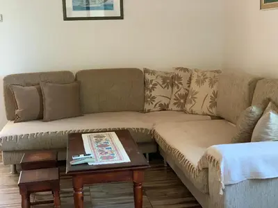a living room with a couch and a coffee table at Holiday Home Bratica in Ulcinj