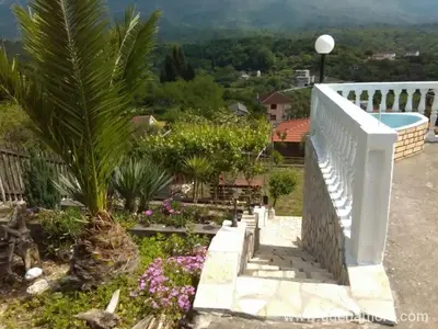 a stairway leading up to a garden with flowers at Holiday Home Bratica in Ulcinj