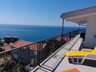 a balcony with a view of the ocean at Apartment Light House in Dobra Voda
