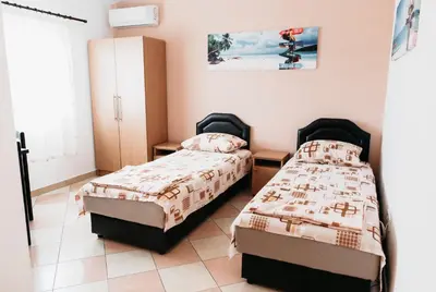 a bedroom with two beds in a room at Guest House Lalic in Bar