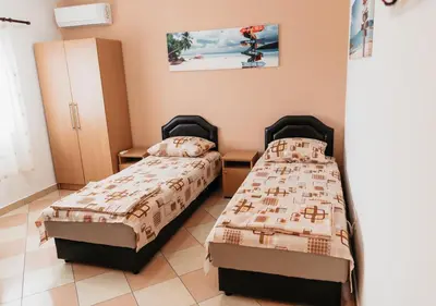 a room with two beds in a room at Guest House Lalic in Bar