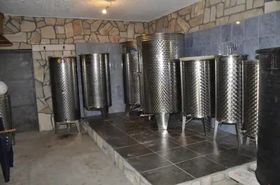 a row of wine bottles in a tasting room at Guest House Lalic in Bar