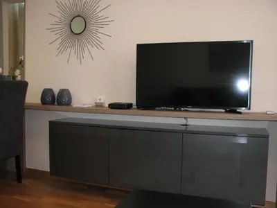 a flat screen tv sitting on top of a table at Apartments B&S Lux in Budva