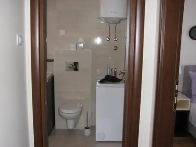 a bathroom with a toilet and a sink at Apartments B&S Lux in Budva