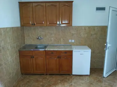 a kitchen with a sink and a refrigerator at Apartments Dukat in Ulcinj