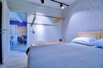 a bedroom with a large bed in a room at Jaz Garden Residence in Budva