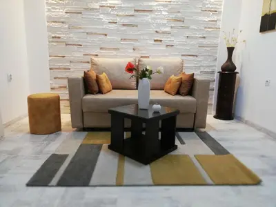 a living room with a couch and a table at Apartments House 91 in Kotor