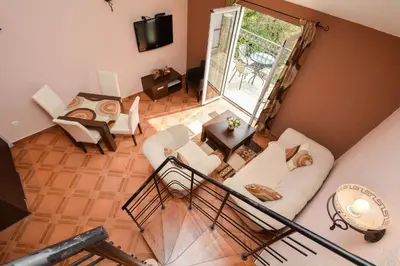 an overhead view of a living room with white furniture at Apartments House 91 in Kotor