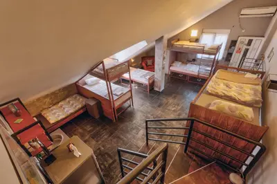 an overhead view of a room with beds and a kitchen at Q PODGORICA Beds,Rooms and more in Podgorica