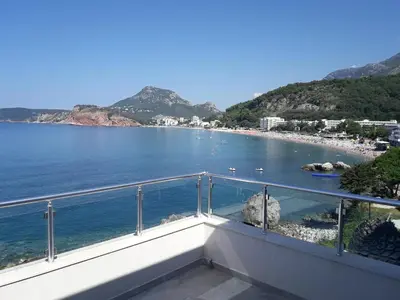 a balcony with a view of a beach at Two Palms Apartment in Sutomore